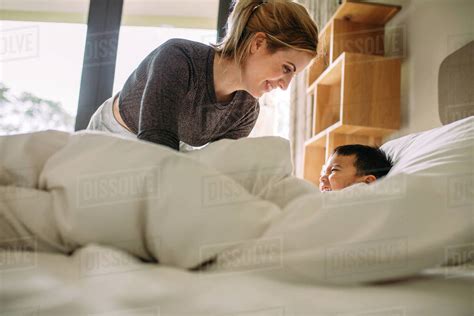 As a parent, having my kids catch me in the act would by-far top my list of embarrassing moments. . Mom and son share bed